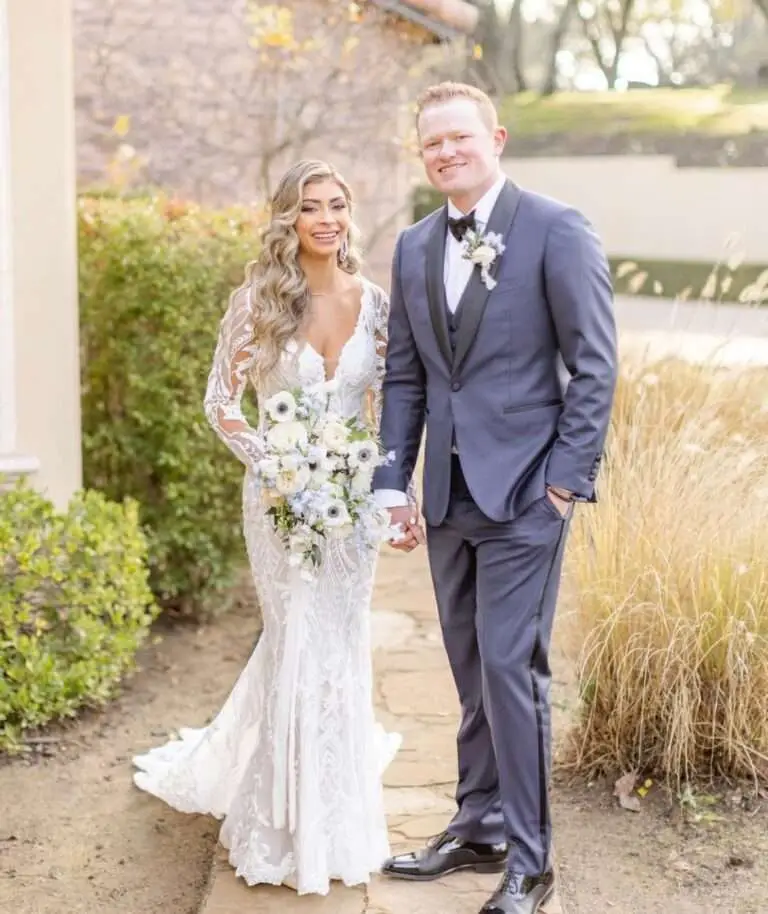 Groom wearing a custom J.Hilburn suit styled by Twin Cities wardrobe expert Denise McBride—offering luxury, made-to-measure menswear for weddings across Minneapolis, St. Paul, and greater Minnesota.