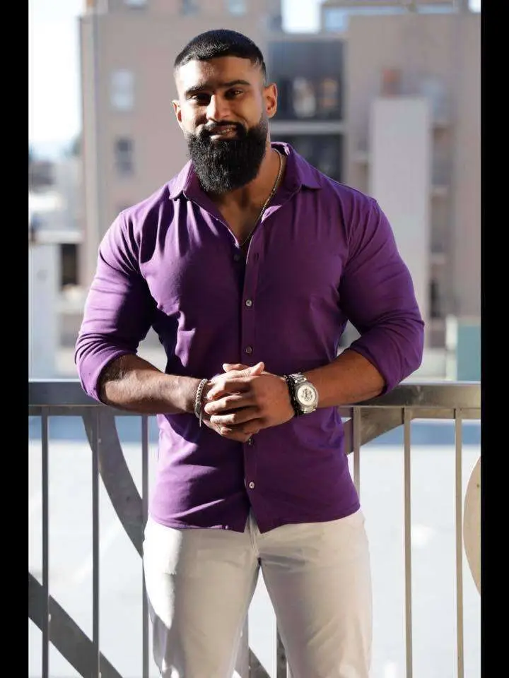 Groom wearing a custom J.Hilburn suit styled by Twin Cities wardrobe expert Denise McBride—offering luxury, made-to-measure menswear for weddings across Minneapolis, St. Paul, and greater Minnesota.