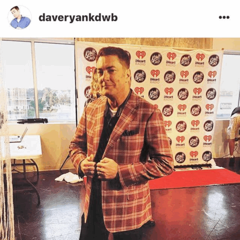 Dave Ryan at KDWB Star Party wearing a REDA flexo bold plaid sport coat with denim chambray custom shirt and dark wash custom denim