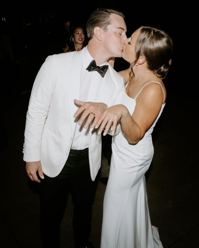 ivory white tuxedo black tuxedo trouser black tie wedding groom